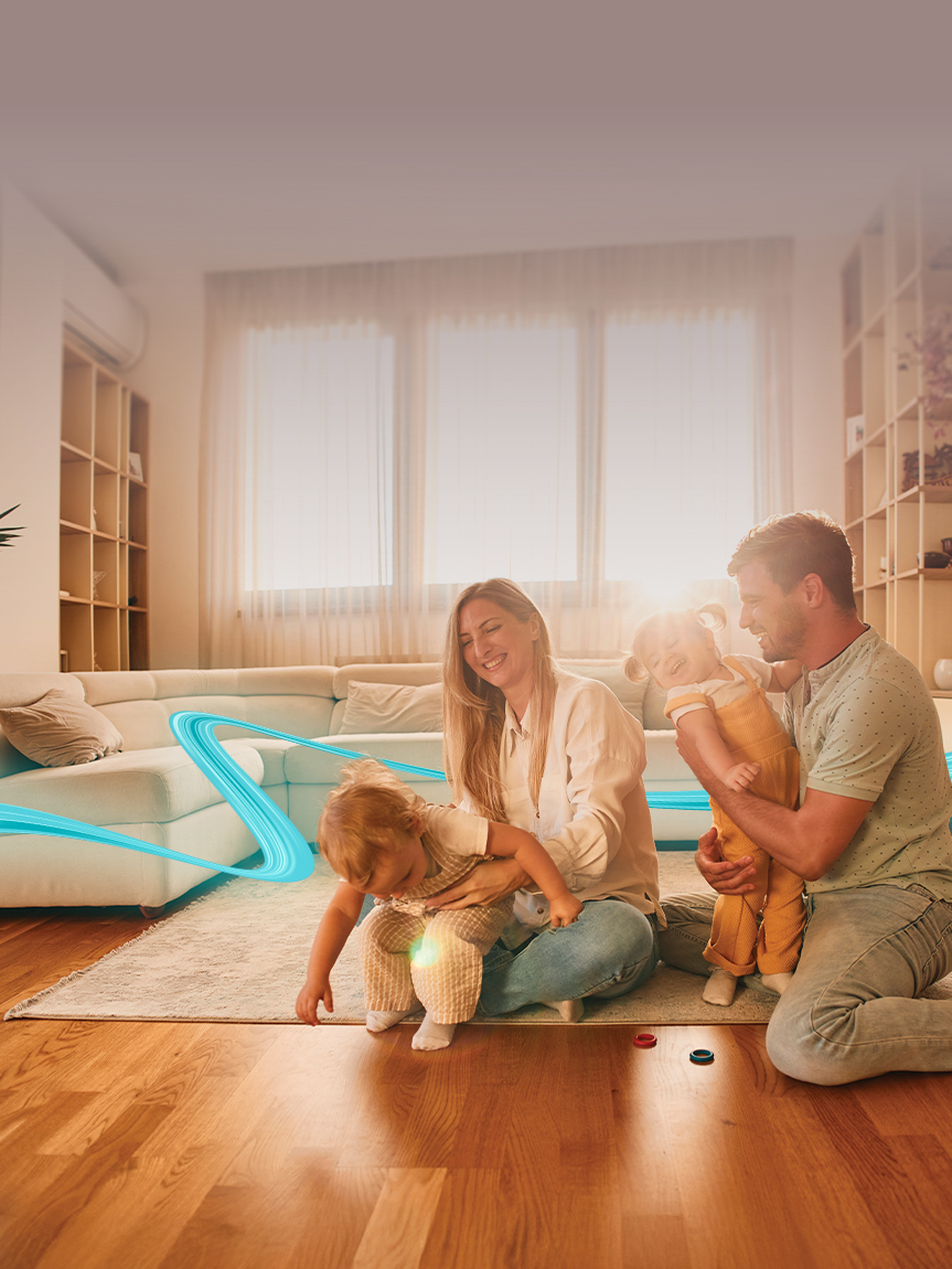 Dad pushing Daughter in Cardboard box on Hardwood Floors in Home.